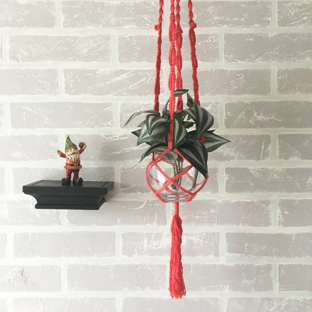 Handmade red cotton macrame plant  hanger.